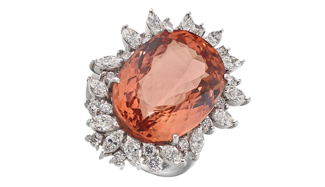 Late C20th.<br>An Imperial Topaz & Marquise, Tapered Baguette<br>& Brilliant Cut Diamond set Ring <br>(T: 19.52cts, D. Est.: 1.51cts)